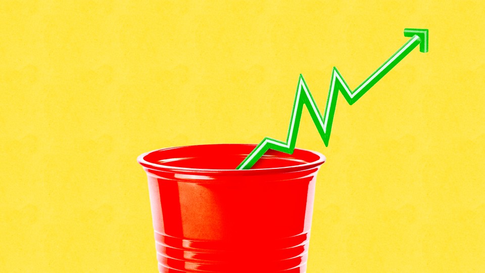 A plastic cup with the straw showing how prices are rising