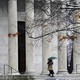 A person with an umbrella walks outside on the Princeton University campus. 