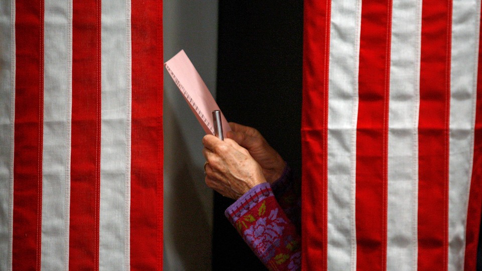 Someone in a voting booth