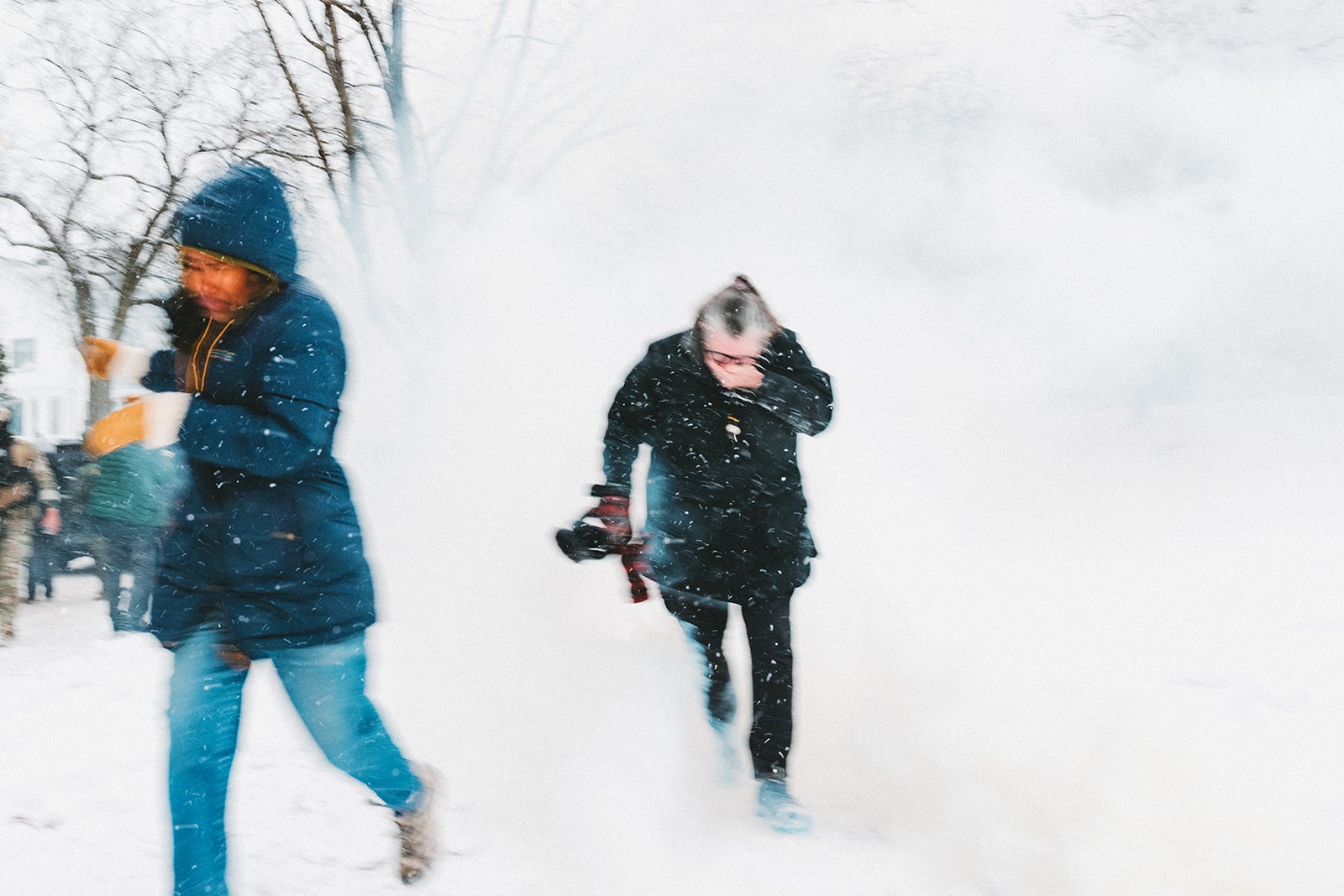 Two people flee tear gas spray