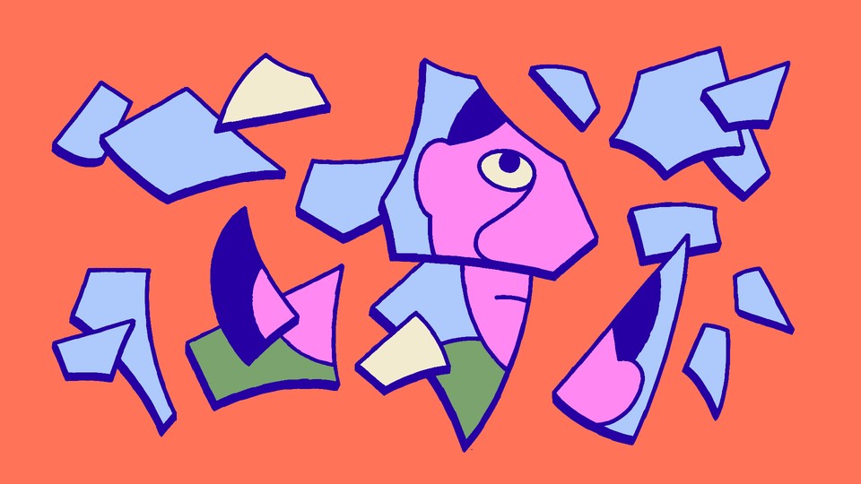 A person's reflection in shards of broken glass