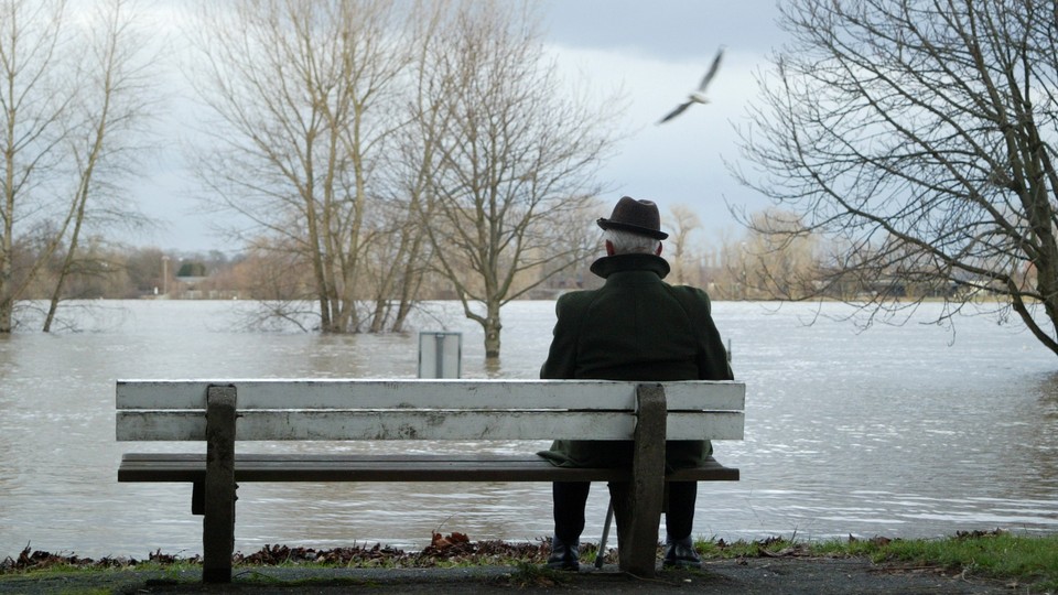 A man sitting alone on a bench