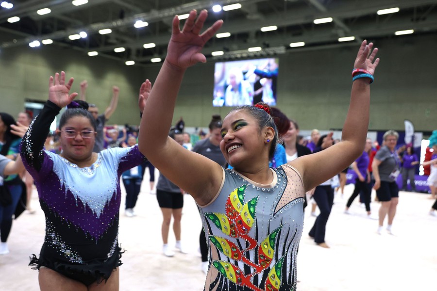 Gymnasts and others dance together.