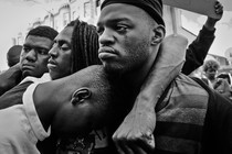 Emotional protesters embrace in West Baltimore over the death of Freddie Gray, 25, who died in police custody in 2015.