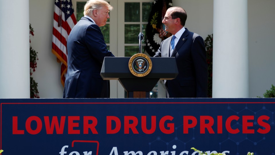 President Trump shakes hands with Health and Human Services Secretary Alex Azar after delivering a speech on prescription-drug prices.