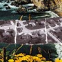 Housing in California over postcard with coastal scene