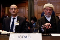 Israeli deputy attorney general for international law Gilad Noam and British jurist Malcolm Shaw sit on the day the International Court of Justice rule on emergency measures against Israel following accusations by South Africa that the Israeli military operation in Gaza is a state-led genocide, in The Hague, Netherlands, January 26, 2024.