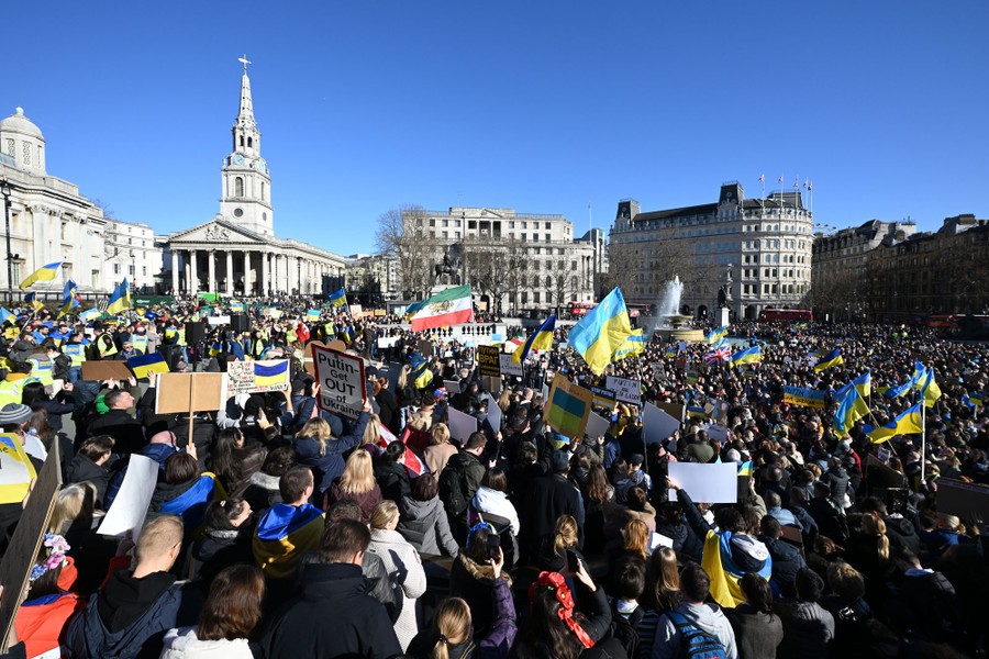 A large crowd of protesters fills London's Trafalgar Square.