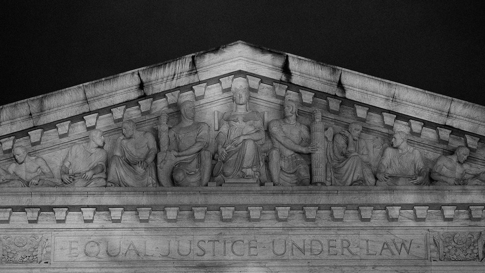 A roof engraving that reads "Equal Justice Under Law"