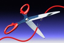 An illustration of scissors cutting an electric wire.