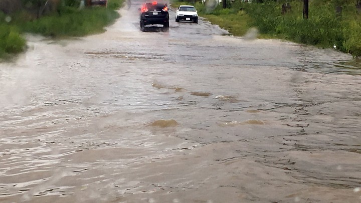 Two cars are blocked by floodwaters from Hurricane Irma in St. John's, Antigua and Barbuda.