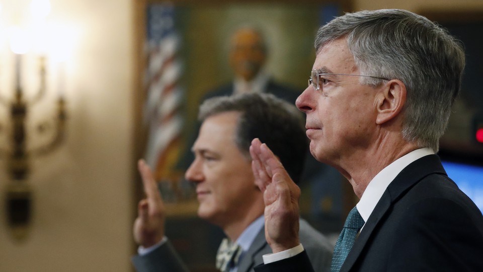 William Taylor (<i>right</i>) and George Kent (<i>left</i>) are sworn in to testify before the House Intelligence Committee on Capitol Hill.