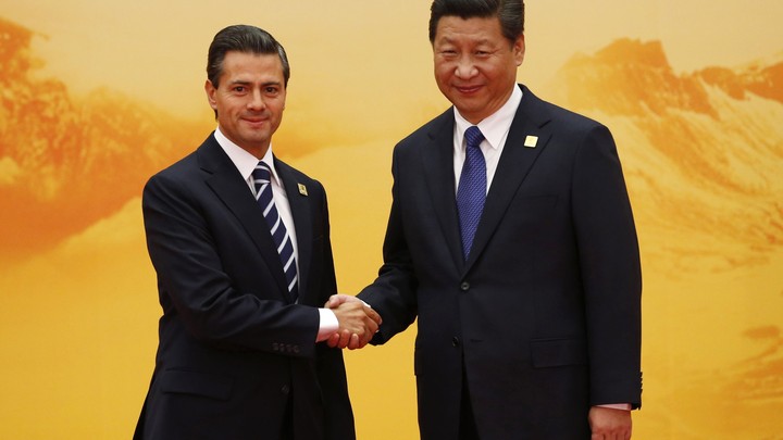 Mexico's President Nieto shakes hands with China's President Jinping.