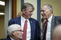 Rep. Paul Gosar (R-AZ) speaks with Rep. Andy Biggs (R-AZ) during a House Oversight Committee hearing titled "The Basis for an Impeachment Inquiry of President Joseph R. Biden, Jr." on Capitol Hill S