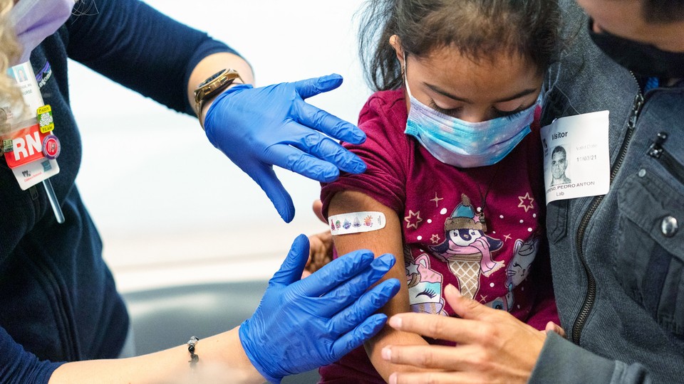a child getting a COVID vaccine