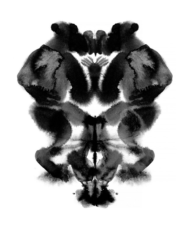 Illustration of Rorschach-style symmetrical inkblots in the shape of primates facing each other