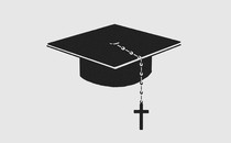 A black graduation cap with a rosary beaded-cross hanging from it.