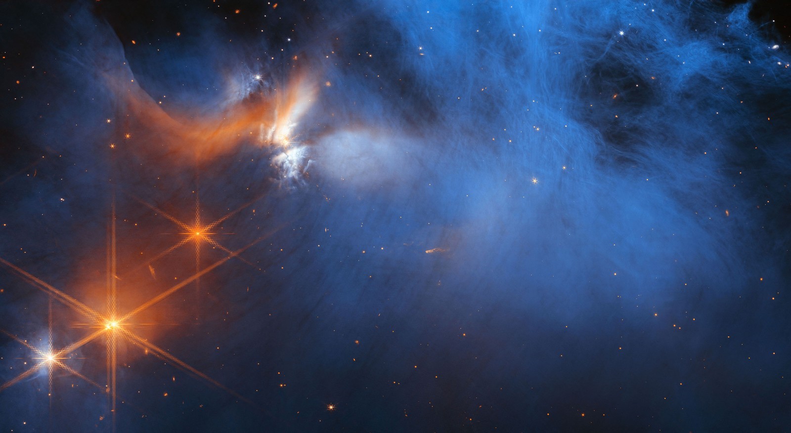 A large, dark cloud is contained within the frame. In its top half it is textured like smoke and has wispy gaps, while at the bottom and at the sides it fades gradually out of view. On the left are several orange stars. 