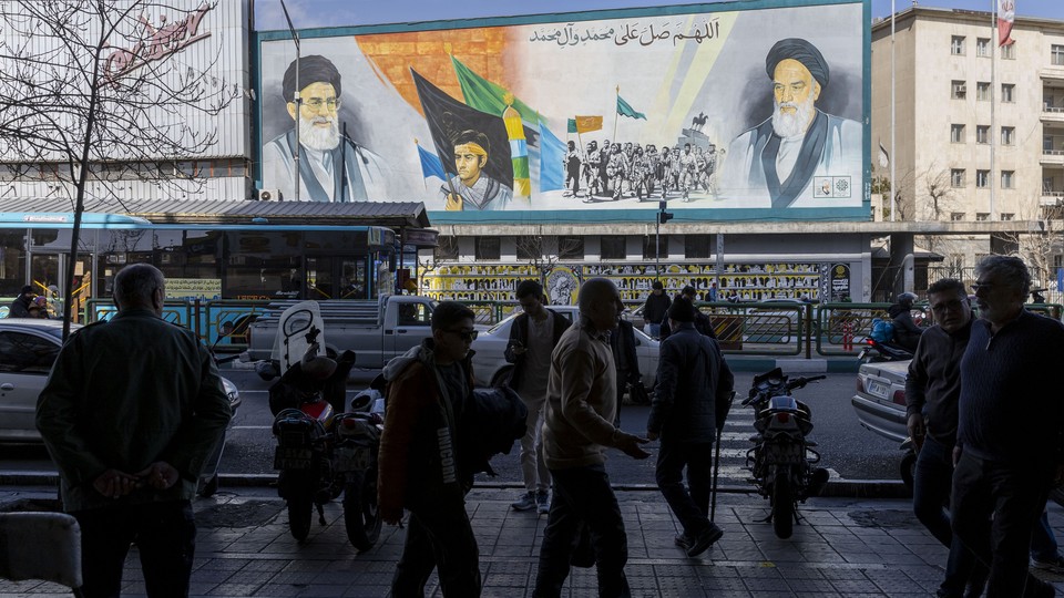 Iranians walking in downtown Tehran