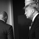 Black-and-white photo of Donald Trump with a Secret Service officer in the background