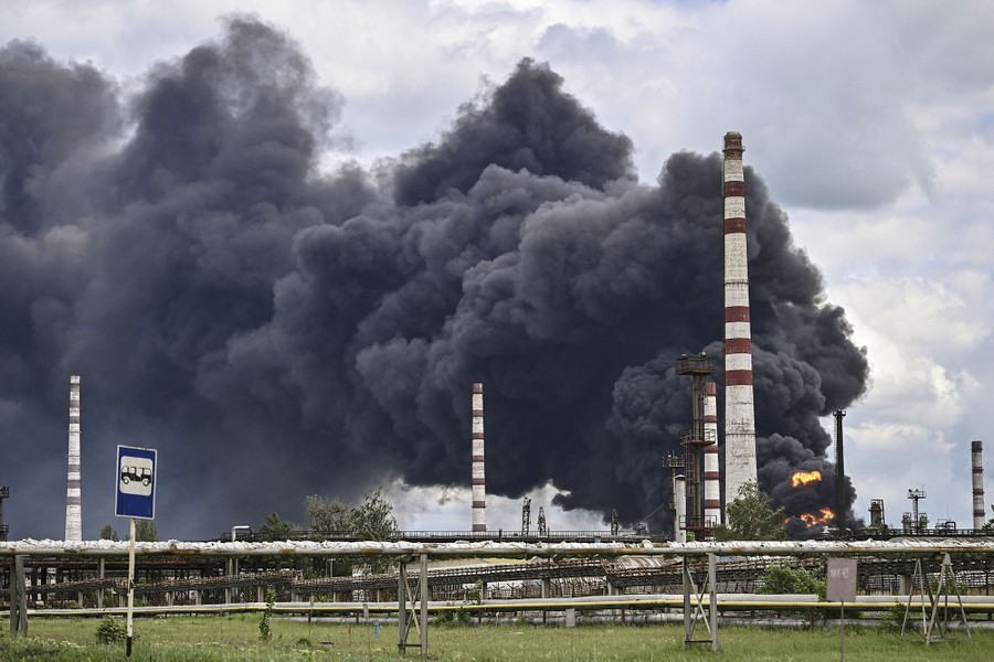 Smoke rises from an oil refinery after an attack.