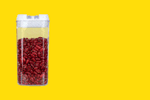 A GIF of three clear acrylic containers filled with red beans
