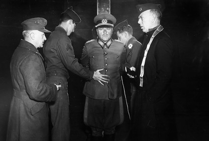 A German military leader is tied to a stake before his execution
