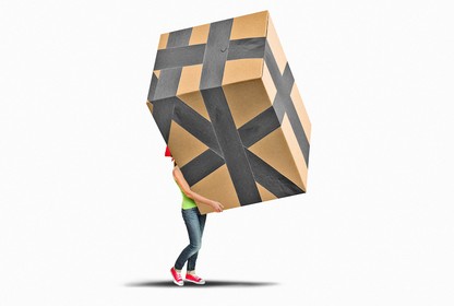 A woman carrying a huge box