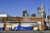 Tents housing homeless people line up in front of closed storefronts near downtown Los Angeles, California, on February 16, 2022.