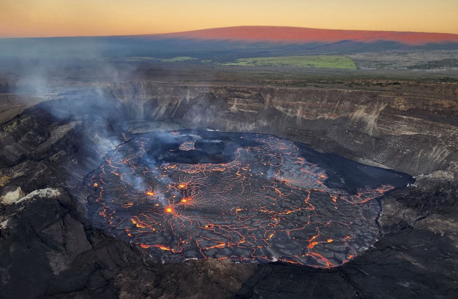 A view of a lava-filled volcanic crater