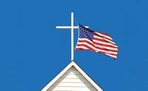 photo-illustration of white cross atop white wooden church steeple with U.S. flag flying from it against blue sky