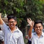Reuters reporters Wa Lone and Kyaw Soe Oo walk to Insein prison gate after being freed.