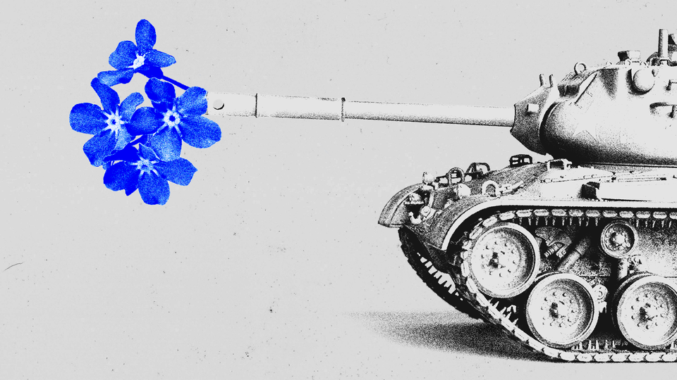 blue flowers in the barrel of an army tank