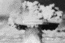An animation depicting a loading bar on top of an image of a mushroom cloud