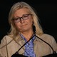 Liz Cheney in front of a microphone