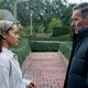 Quintessa Swindell and Joel Edgerton stare at each other while standing in a garden, in "Master Gardener."