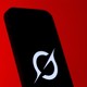 An image of a phone with the Grok logo