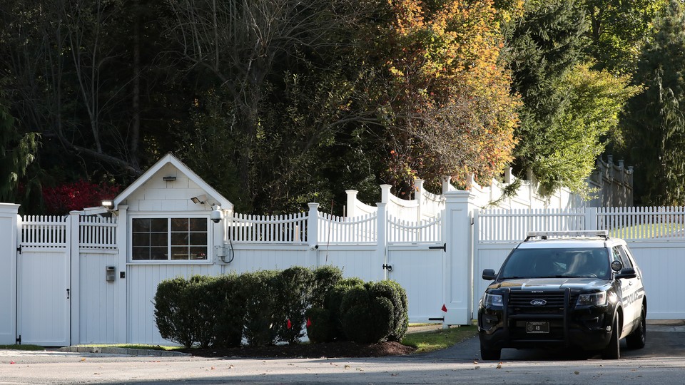 A car sits outside the home of Bill and Hillary Clinton in Chappaqua, New York.