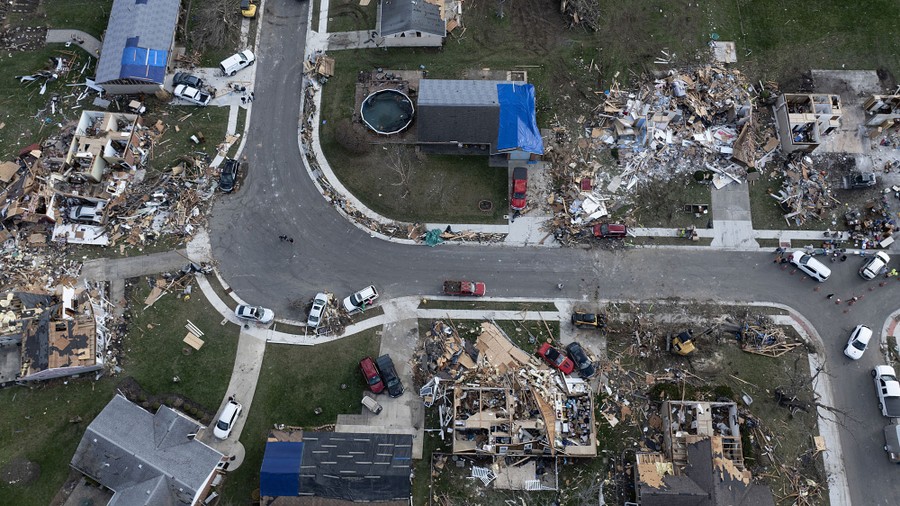 An aerial view of houses damaged and destroyed by a tornado.