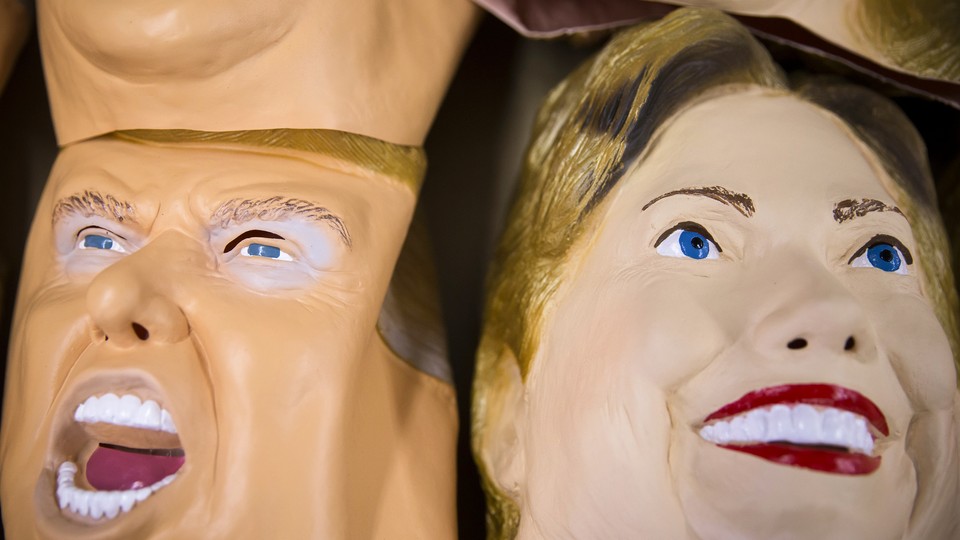 Rubber masks in the likeness of Donald Trump and Hillary Clinton are stacked at a factory in Saitama, Japan.