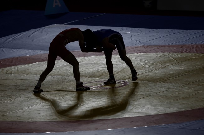 two wrestlers compete