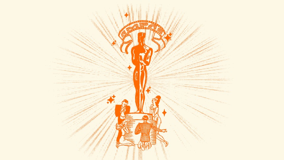 An Academy Award with people looking up at it