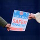 Women hold a sign as they form a human chain on the first anniversary of the Covenant School shooting in Nashville, Tennessee, March 27, 2024.
