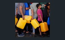 Photo of Palestinians in line for water