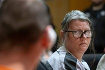 Jennifer Crumbley looks at her husband James Crumbley during their sentencing on four counts of involuntary manslaughter for the deaths of four Oxford High School students by their son, mass school shooter Ethan Crumbley, on April 9, 2024 at Oakland County Circuit Court in Pontiac, Michigan.