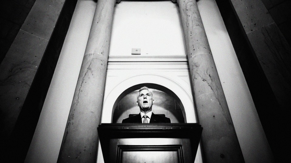 A black-and-white photo of Kevin McCarthy speaking at a podium