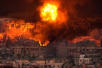 Flames rise after an Israeli air strike in the southern suburbs of Beirut on Saturday