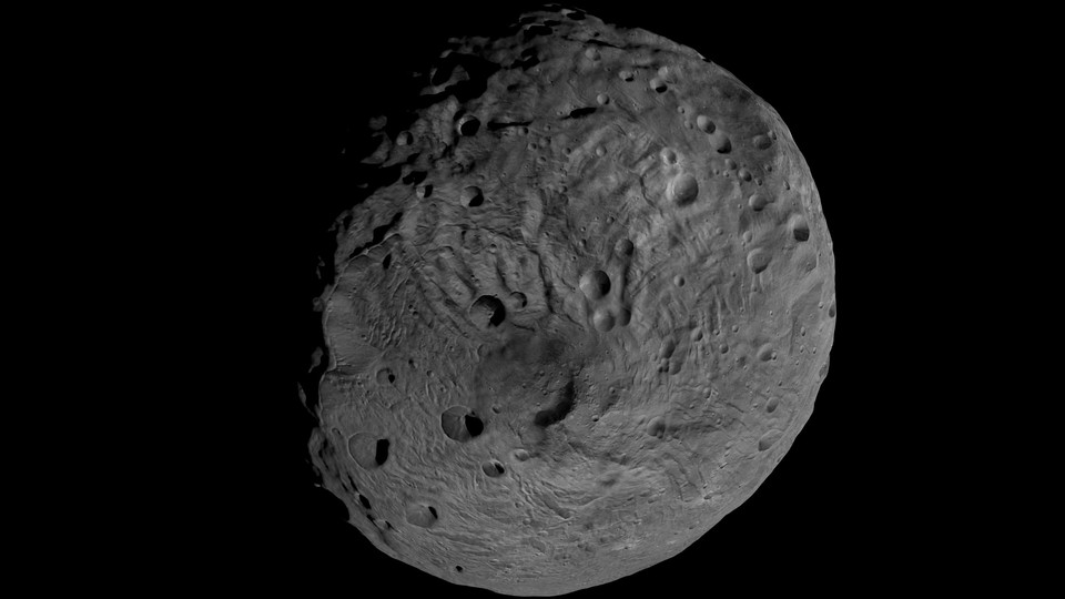 Vesta, a rocky asteroid orbiting between between Mars and Jupiter