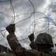 U.S. Army soldiers install concertina wire along the U.S.-Mexico border in Hidalgo, Texas.