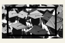 A black-and-white image of students wearing graduation caps